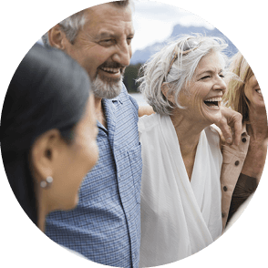 People in a group hug and laughing