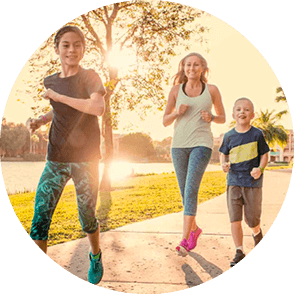 Two boys and lady having a run